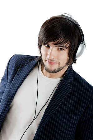 simsearch:400-05349451,k - Young Man listening to music with headphones Foto de stock - Super Valor sin royalties y Suscripción, Código: 400-04109142