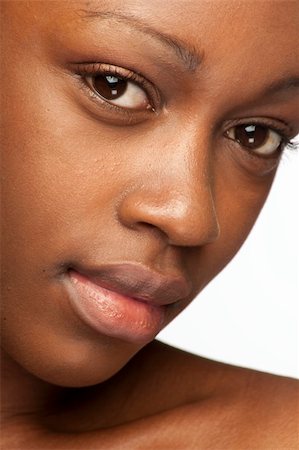 pedi - African woman with natural make-up headshoot Photographie de stock - Aubaine LD & Abonnement, Code: 400-04109310