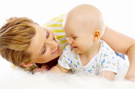 simsearch:400-08376526,k - Young attractive mother kissing cute little baby Photographie de stock - Aubaine LD & Abonnement, Code: 400-04109852