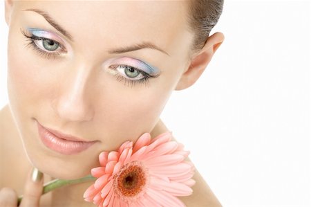 Portrait of the beautiful woman with a make-up and pink gerbera, isolated Stock Photo - Budget Royalty-Free & Subscription, Code: 400-04109889