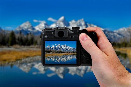 photographer mirror - Hand holding camera taking a picture of Teton Mountains and River Stock Photo - Budget Royalty-Free & Subscription, Code: 400-04102336