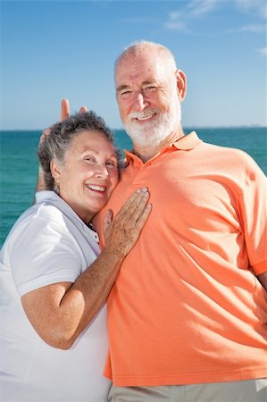 simsearch:400-04109826,k - Senior couple on vacation - he's giving her rabbit ears. Fotografie stock - Microstock e Abbonamento, Codice: 400-04102769