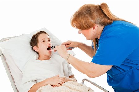 Nurse uses a tongue depressor and otoscope to examine little boy in hospital. Stock Photo - Budget Royalty-Free & Subscription, Code: 400-04103850