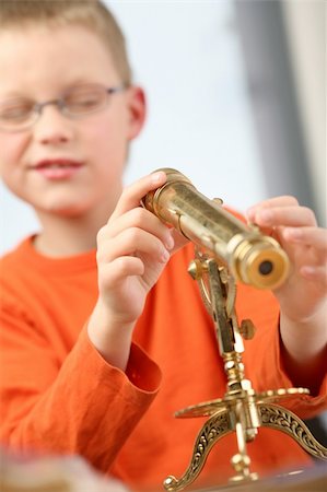 simsearch:632-01156895,k - Boy is looking through a classic telescope. Stock Photo - Budget Royalty-Free & Subscription, Code: 400-04114172