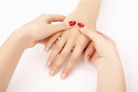 simsearch:400-06061806,k - Massage of female hands by the female hands, isolated Stock Photo - Budget Royalty-Free & Subscription, Code: 400-04114192