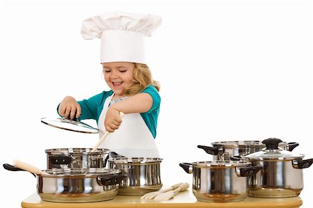 Happy chef girl stirring soup in a bowl - isolated Stock Photo - Budget Royalty-Free & Subscription, Code: 400-04114222