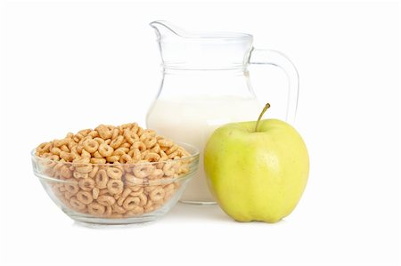 simsearch:400-03917186,k - A bowl of cornflakes, fresh apple and milk pitcher on white background Stock Photo - Budget Royalty-Free & Subscription, Code: 400-04114274