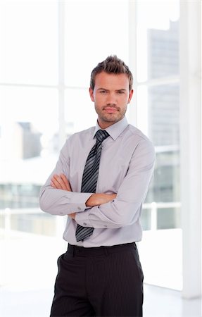 simsearch:400-05118165,k - Attactive serious businessman with folded arms Stock Photo - Budget Royalty-Free & Subscription, Code: 400-04114577