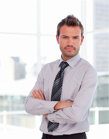 simsearch:400-05118165,k - Attactive serious businessman with folded arms Stock Photo - Budget Royalty-Free & Subscription, Code: 400-04114578