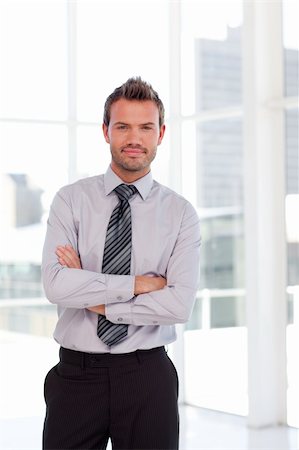simsearch:400-05118165,k - Attactive serious businessman with folded arms Stock Photo - Budget Royalty-Free & Subscription, Code: 400-04114579