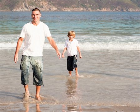 Young father and son playing on a beach Stock Photo - Budget Royalty-Free & Subscription, Code: 400-04114589