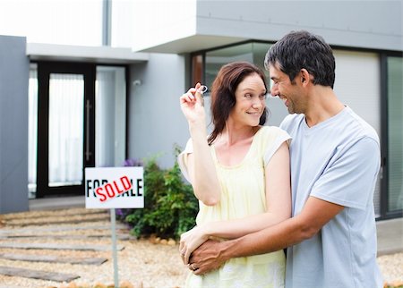 Young couple celebrating their new house Stock Photo - Budget Royalty-Free & Subscription, Code: 400-04114644