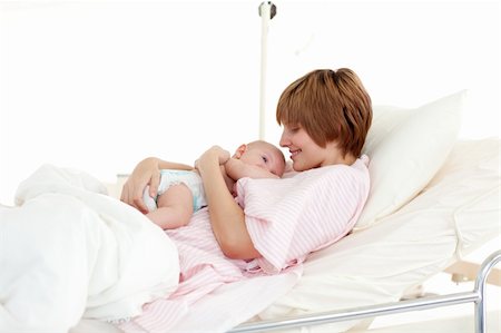 Mother talking to her newborn baby in the hospital Stock Photo - Budget Royalty-Free & Subscription, Code: 400-04114657