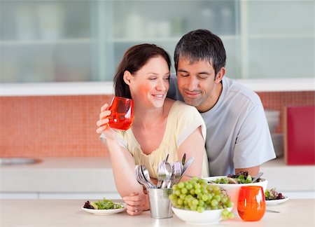 simsearch:400-04878558,k - Lovely couple eating and drinking in the kitchen Stock Photo - Budget Royalty-Free & Subscription, Code: 400-04114650