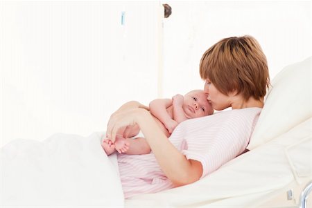 simsearch:400-04118442,k - Mother kissing her newborn baby in a hospital Stock Photo - Budget Royalty-Free & Subscription, Code: 400-04114663