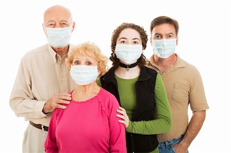Family - elderly parents, their adult son, and teen granddaughter - wearing surgical masks to protect from an epidemic. Stock Photo - Budget Royalty-Free & Subscription, Code: 400-04114752
