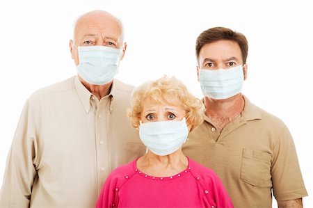 Elderly parents and their adult son wearing face masks to protect against a health care epidemic. Foto de stock - Super Valor sin royalties y Suscripción, Código: 400-04114753