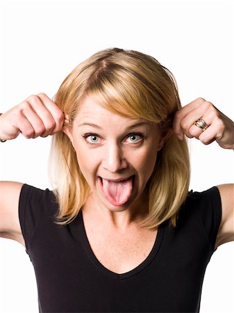 simsearch:400-04807075,k - Blond woman making a funny face Foto de stock - Super Valor sin royalties y Suscripción, Código: 400-04115511