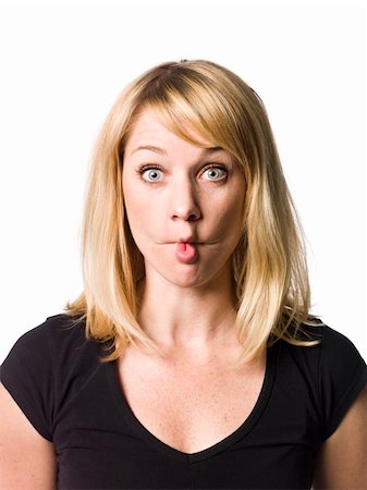 simsearch:400-04807075,k - Blond woman making a funny face Foto de stock - Super Valor sin royalties y Suscripción, Código: 400-04115528