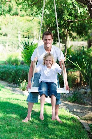 father board game not chess - Father and son on a swing in a park Stock Photo - Budget Royalty-Free & Subscription, Code: 400-04116360