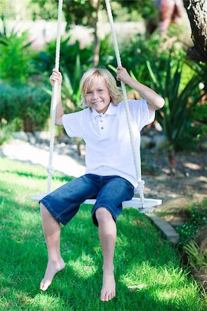 simsearch:400-06173192,k - Child playing with a swing in a park Foto de stock - Super Valor sin royalties y Suscripción, Código: 400-04116363