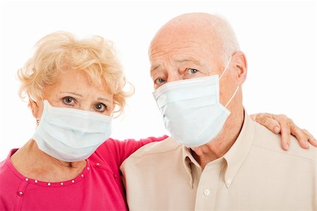 Senior couple wearing face masks to protect against swine flu epidemic. Stock Photo - Budget Royalty-Free & Subscription, Code: 400-04116787