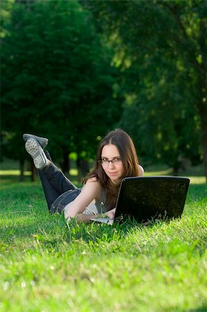 simsearch:6109-06003526,k - student with notebook in the park Stock Photo - Budget Royalty-Free & Subscription, Code: 400-04116885