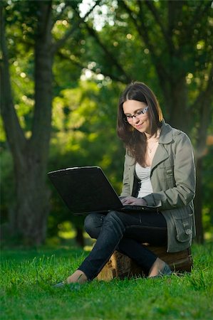 simsearch:6109-06003537,k - student with notebook in the park Fotografie stock - Microstock e Abbonamento, Codice: 400-04116889