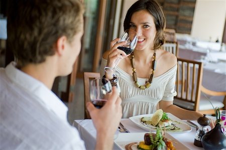 eastwestimaging (artist) - A young couple sitting together in a sophisticaed restaurant Fotografie stock - Microstock e Abbonamento, Codice: 400-04116904