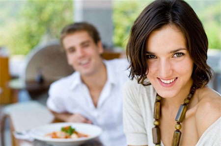 A young couple on vacation eating lunch at a relaxed outdoor restaurant Stock Photo - Budget Royalty-Free & Subscription, Code: 400-04116919