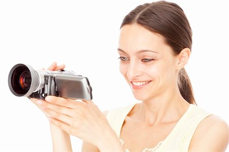 Young happy woman holding small video camera. Isolated over white background. Stock Photo - Budget Royalty-Free & Subscription, Code: 400-04117176