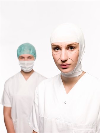 facelift bandage - Woman prepared for plastic surgery with a nurse at her back Stock Photo - Budget Royalty-Free & Subscription, Code: 400-04117248