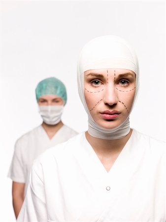 facelift bandage - Woman prepared for plastic surgery with a nurse at her back Stock Photo - Budget Royalty-Free & Subscription, Code: 400-04117249