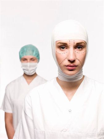 facelift bandage - Woman prepared for plastic surgery with a nurse at her back Stock Photo - Budget Royalty-Free & Subscription, Code: 400-04117250