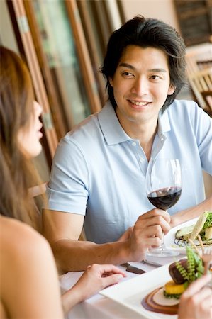 eastwestimaging (artist) - A young man enjoying wine with his meal Fotografie stock - Microstock e Abbonamento, Codice: 400-04117404