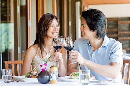 eastwestimaging (artist) - A young Asian couple having dinner at a restaurant Fotografie stock - Microstock e Abbonamento, Codice: 400-04117407