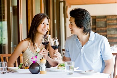 eastwestimaging (artist) - A young Asian couple having dinner at a restaurant Fotografie stock - Microstock e Abbonamento, Codice: 400-04117408