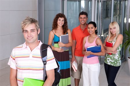 Portrait of happy student with group of students in background Stock Photo - Budget Royalty-Free & Subscription, Code: 400-04117495