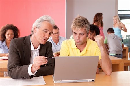 Portrait of happy student with lecturer in a classroom Stock Photo - Budget Royalty-Free & Subscription, Code: 400-04117637