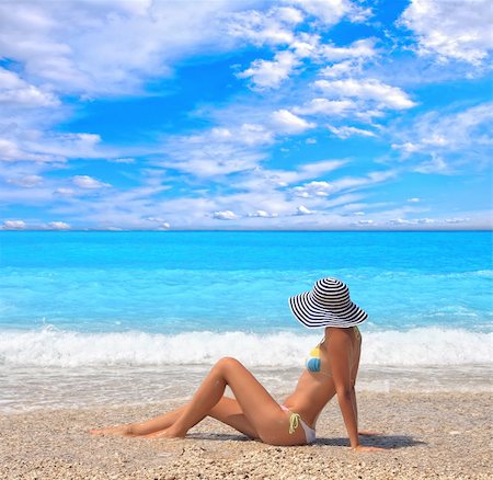 Beautiful young woman enjoying the Ionian sea in Greece Foto de stock - Royalty-Free Super Valor e Assinatura, Número: 400-04118124