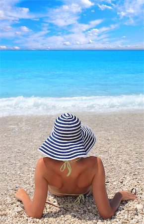 Beautiful young woman enjoying the Ionian sea in Greece Stock Photo - Budget Royalty-Free & Subscription, Code: 400-04118123