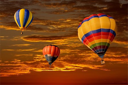 simsearch:400-07975717,k - Colorful hot air balloons against a dramatic red sky Foto de stock - Super Valor sin royalties y Suscripción, Código: 400-04118142