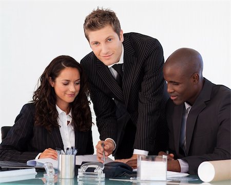 simsearch:400-04113098,k - Young businessman working with his team in an office Stock Photo - Budget Royalty-Free & Subscription, Code: 400-04118200
