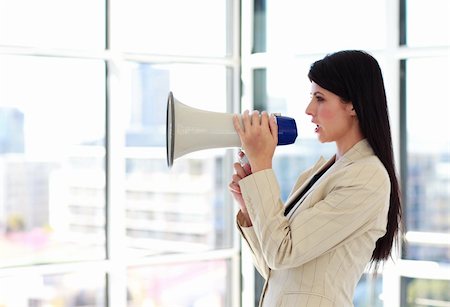 simsearch:400-09223567,k - Attractive young businesswoman shouting through megaphone Stock Photo - Budget Royalty-Free & Subscription, Code: 400-04118228