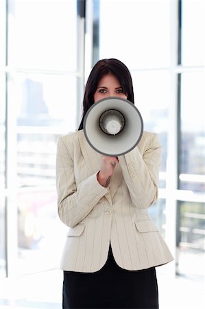 simsearch:400-09223567,k - Attractive brunette businesswoman shouting through megaphone Stock Photo - Budget Royalty-Free & Subscription, Code: 400-04118230