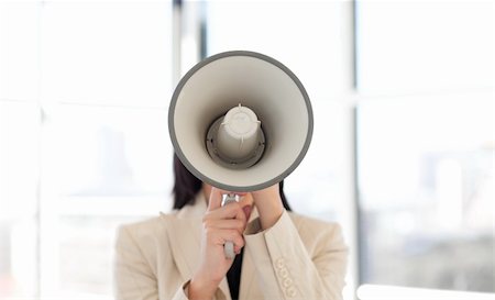 simsearch:400-06763387,k - Portrait of an attractive businesswoman shouting through megaphone Stock Photo - Budget Royalty-Free & Subscription, Code: 400-04118233