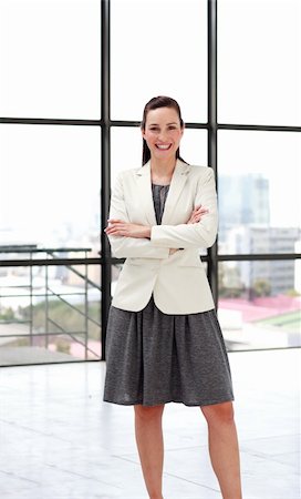 simsearch:400-07246047,k - Beautiful smiling young businesswoman with folded arms Foto de stock - Super Valor sin royalties y Suscripción, Código: 400-04118259