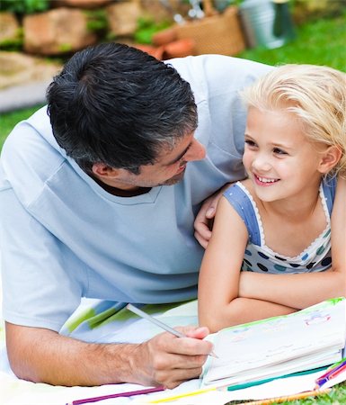 simsearch:400-07715953,k - Dad and daughter doing homework together in a garden Stock Photo - Budget Royalty-Free & Subscription, Code: 400-04118425