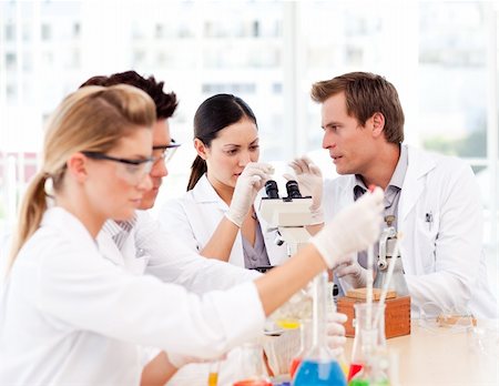 simsearch:400-07091851,k - Young scientists working in a laboratory Stock Photo - Budget Royalty-Free & Subscription, Code: 400-04118504