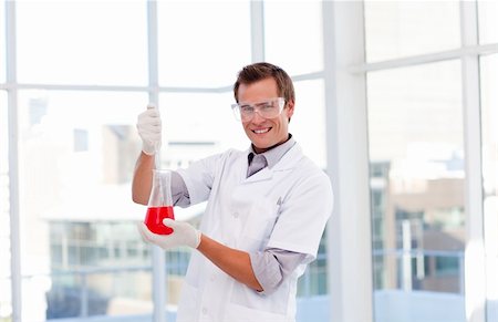 simsearch:400-07091851,k - Isolated young scientist examinig a test-tube Stock Photo - Budget Royalty-Free & Subscription, Code: 400-04118501